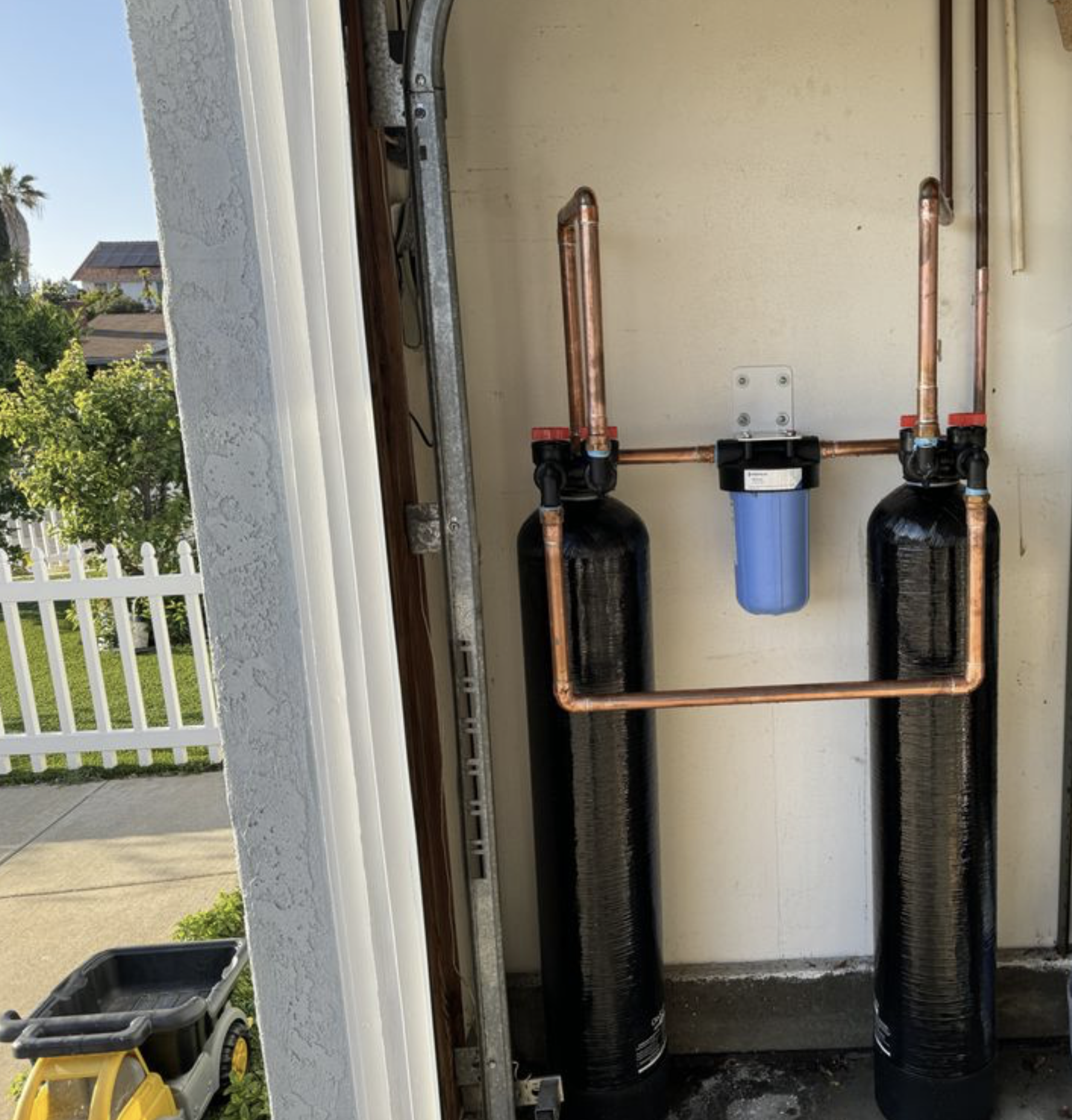 Whole-house filtration system installed in garage.