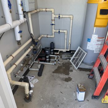 Residential mechanical room plumbing installation.
