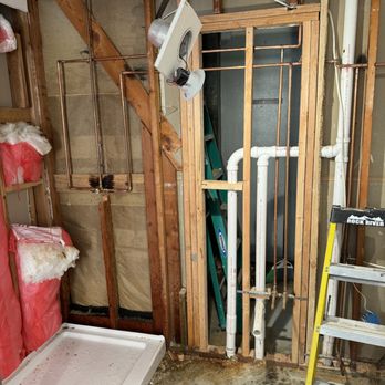 Bathroom plumbing rough-in during renovation.